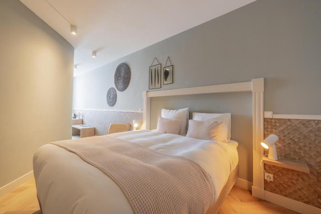 Een bed of bedden in een kamer bij City Hotel Rembrandt