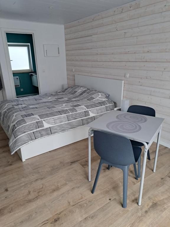 Postel nebo postele na pokoji v ubytování L'école buissonnière