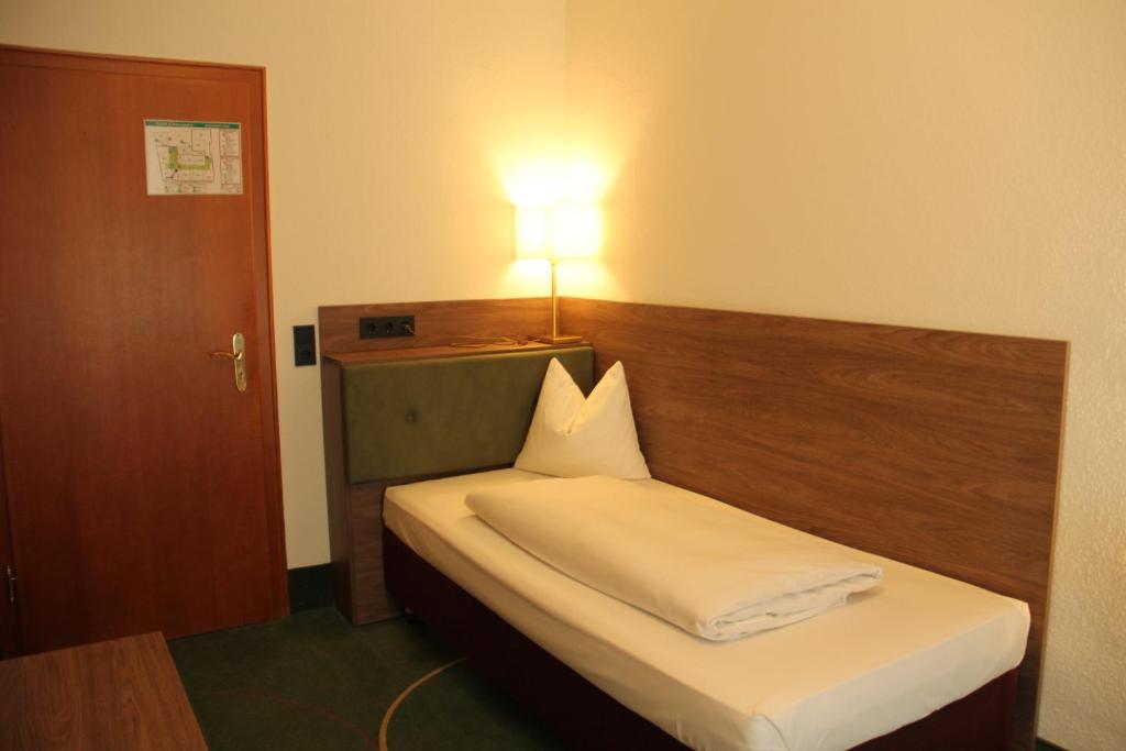 Postel nebo postele na pokoji v ubytování Hotel-Gasthof Wilde Rose