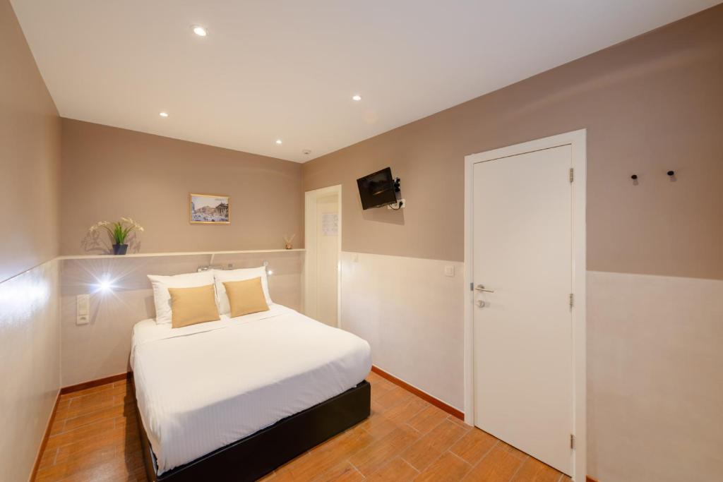 Postel nebo postele na pokoji v ubytování Hotel Barry