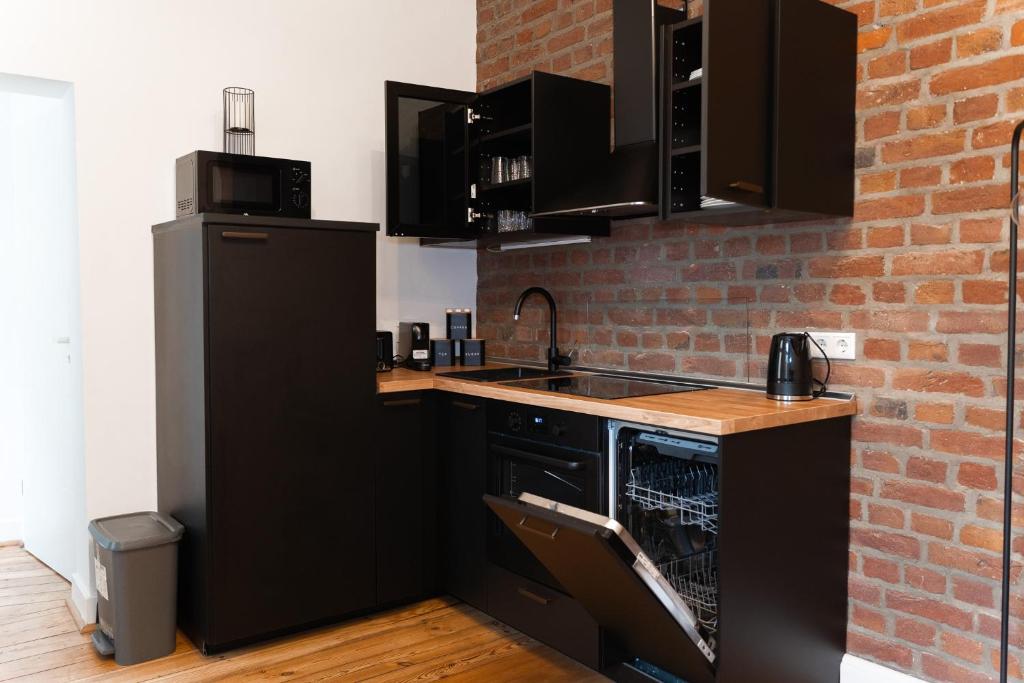 Kuchyň nebo kuchyňský kout v ubytování JUNIK Apartments - Deine Cityapartments in Duisburg
