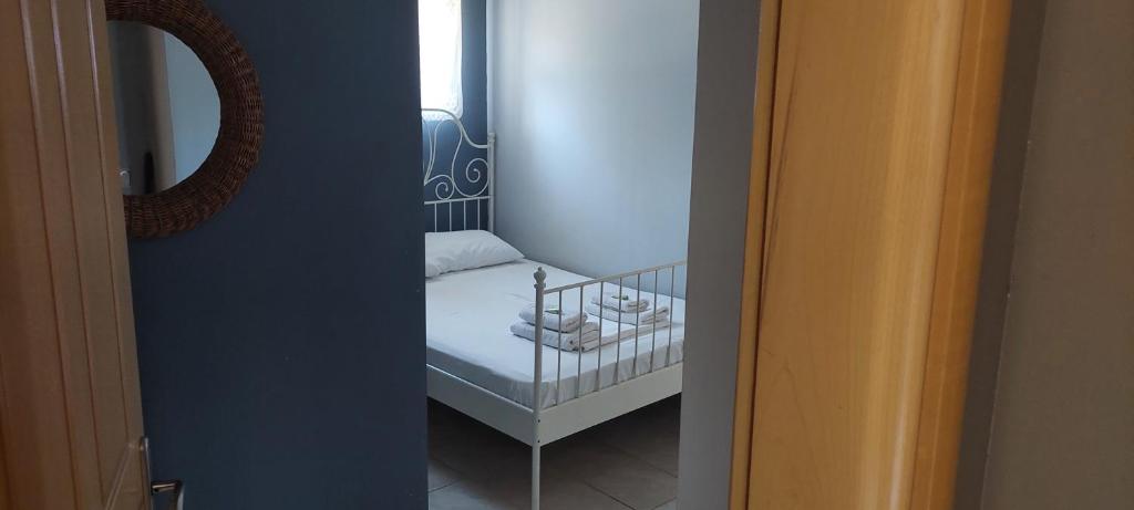 Postel nebo postele na pokoji v ubytování Ktima Holoway Apartments