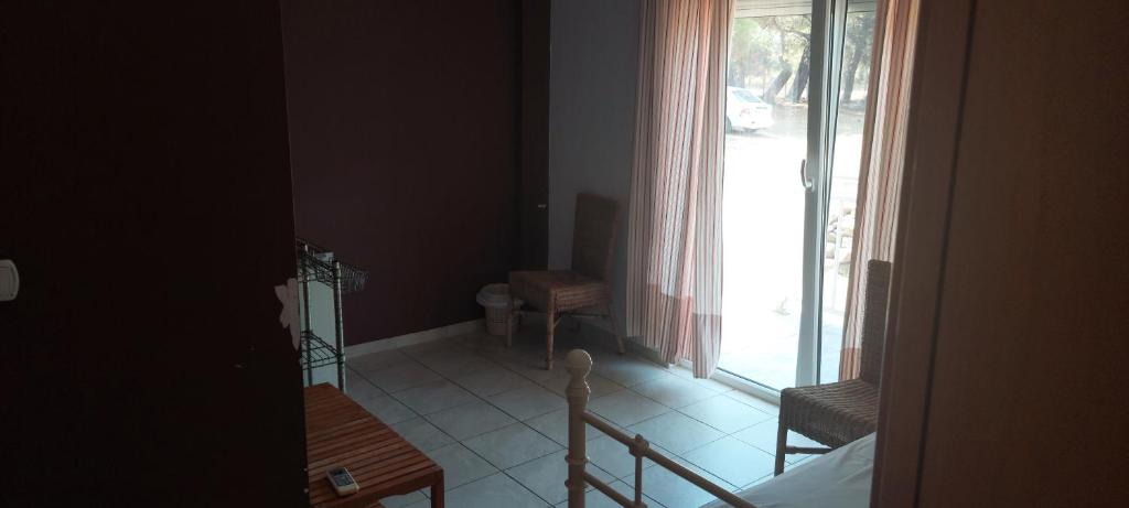 Postel nebo postele na pokoji v ubytování Ktima Holoway Apartments