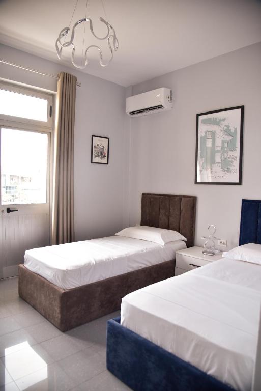 En eller flere senger på et rom på City Center INN