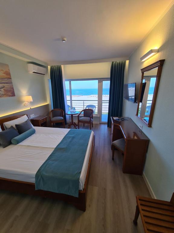 Postel nebo postele na pokoji v ubytování Hotel Comandor