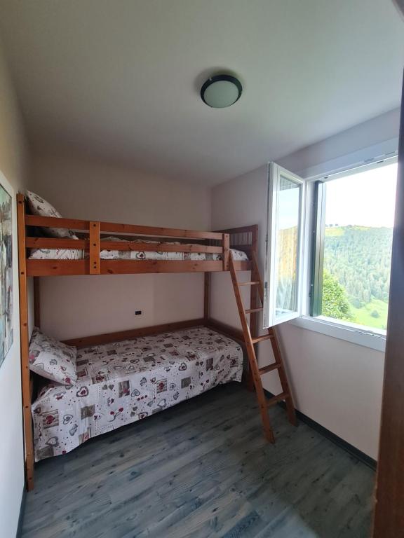 Postel nebo postele na pokoji v ubytování Piccolo Paradiso