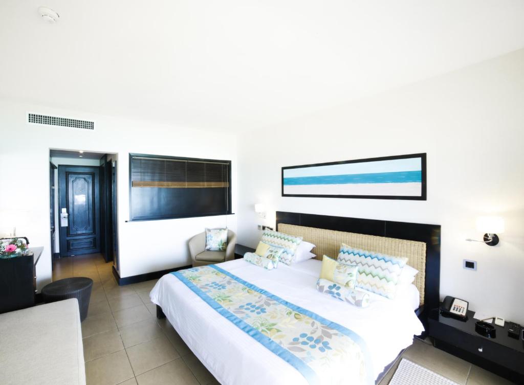Postel nebo postele na pokoji v ubytování Pearle Beach Resort & Spa