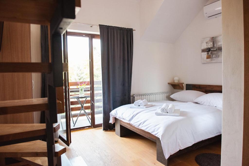 Postel nebo postele na pokoji v ubytování Rooms Enter Ogulin