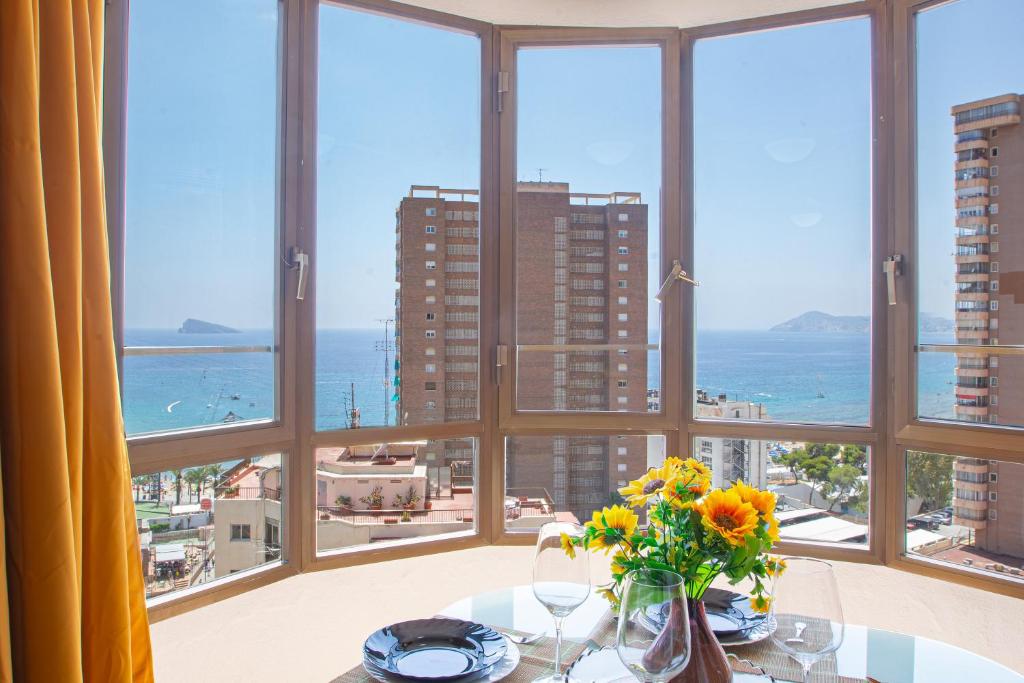 a dining room with a view of the ocean at Ametlla Mar Benidorm in Benidorm