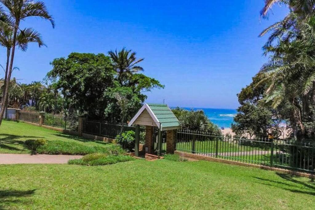 a gazebo in a park next to the ocean at Ramsgate Beachfront - Ramsgate Palms AA 50 in Margate