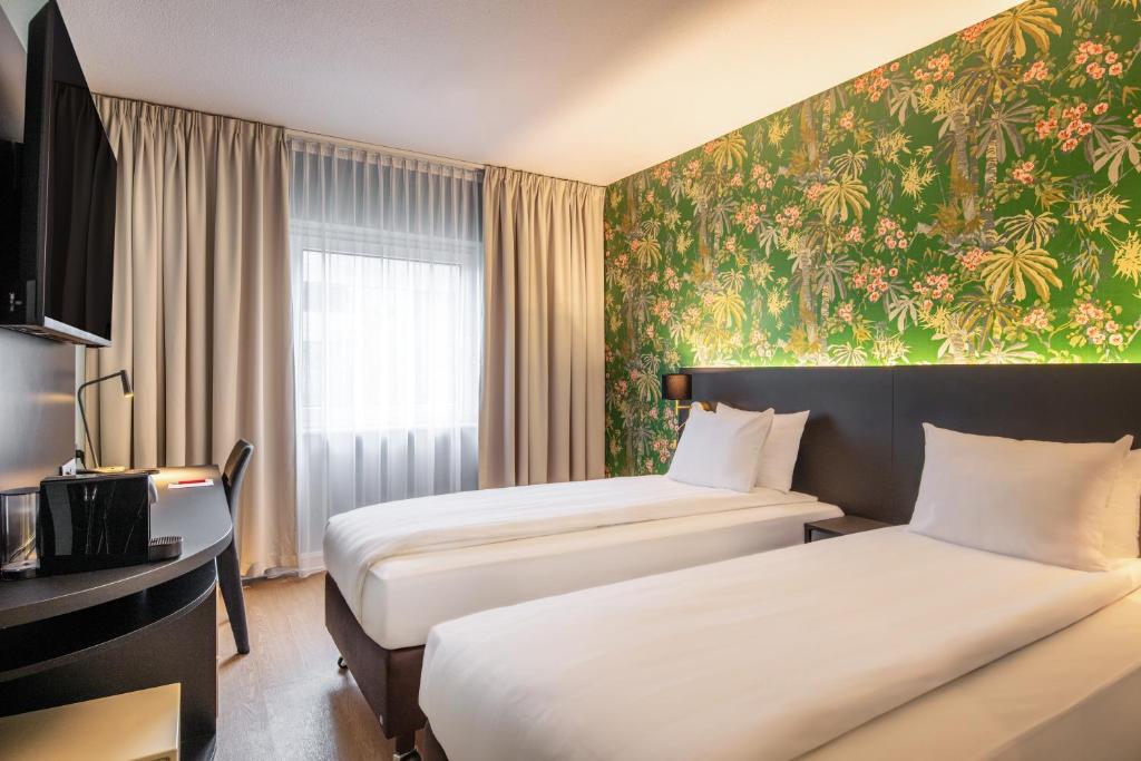 Rúm í herbergi á Thon Hotel Brussels Airport