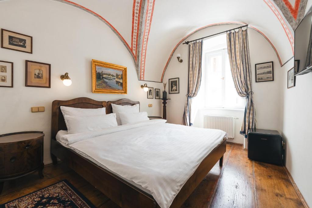 Voodi või voodid majutusasutuse Hotel Leonardo toas