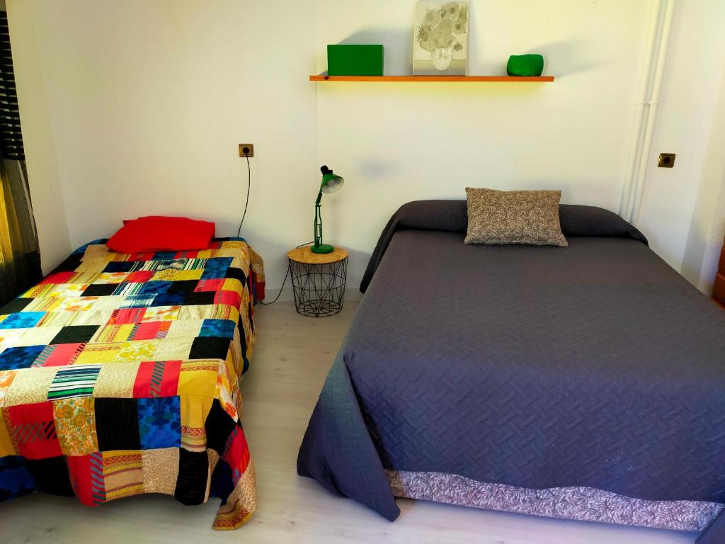 Posteľ alebo postele v izbe v ubytovaní Apartamento en el casco antiguo de Ponferrada