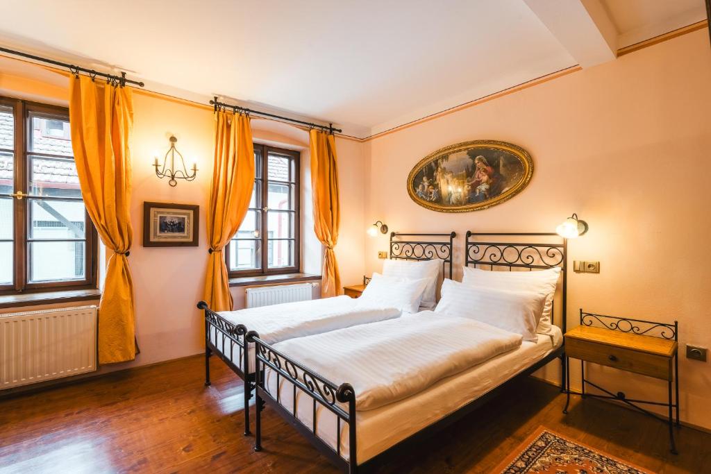 Voodi või voodid majutusasutuse Hotel Leonardo toas