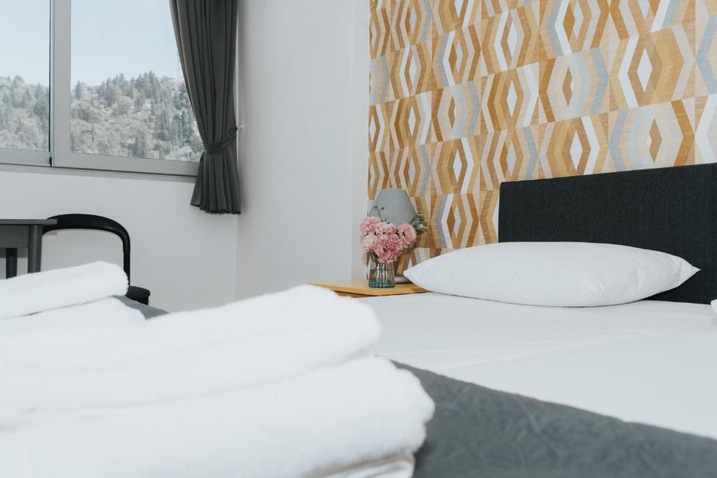 Postel nebo postele na pokoji v ubytování Hotel Tolero