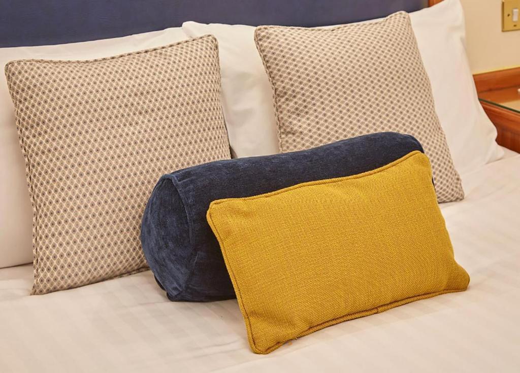 Ein Bett oder Betten in einem Zimmer der Unterkunft Lancaster Gate Hotel