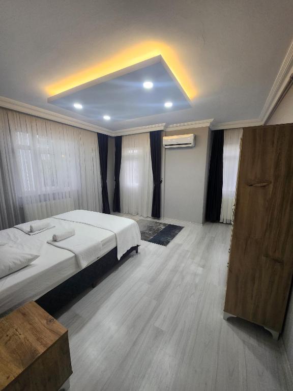 Postel nebo postele na pokoji v ubytování AYKA apart