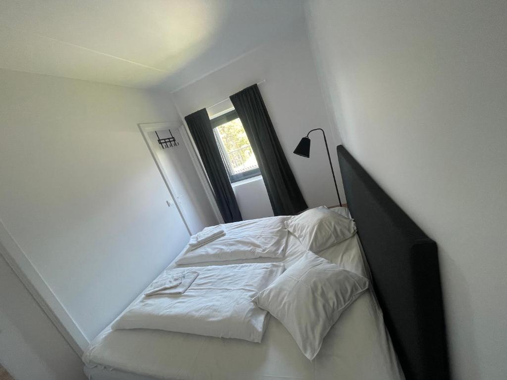 Postel nebo postele na pokoji v ubytování Mitt hotell & apartments