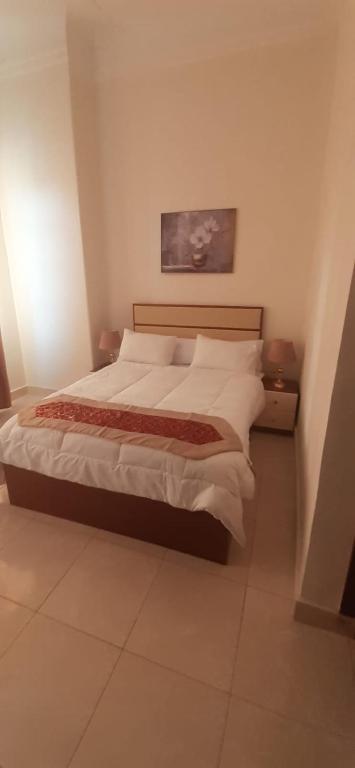 Postel nebo postele na pokoji v ubytování Ismailia House Inn