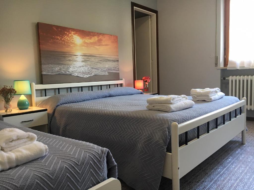 Postel nebo postele na pokoji v ubytování Hotel Gianna