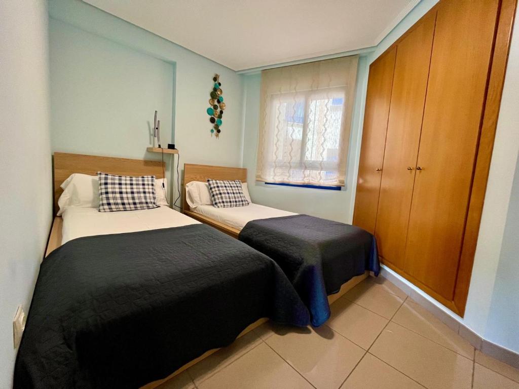 Postel nebo postele na pokoji v ubytování Blue Beach Apartment+Oceanview+Private Parking