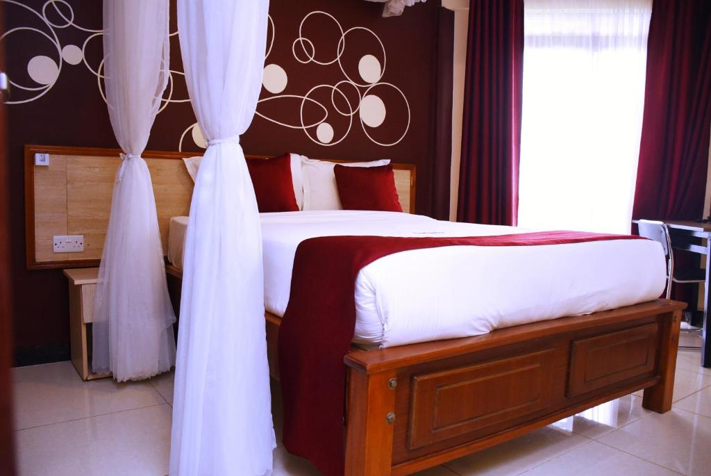 Postel nebo postele na pokoji v ubytování Divine Homes Resort Kisumu