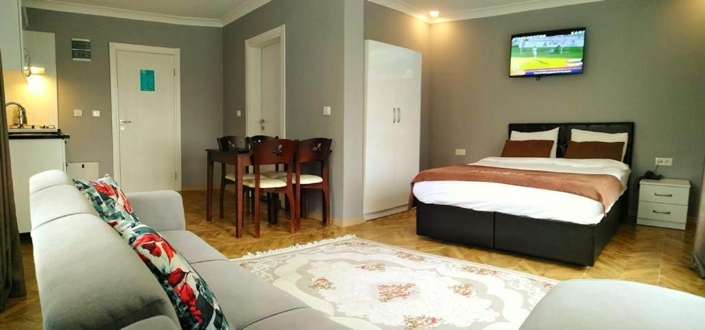 A bed or beds in a room at Anemo Suite