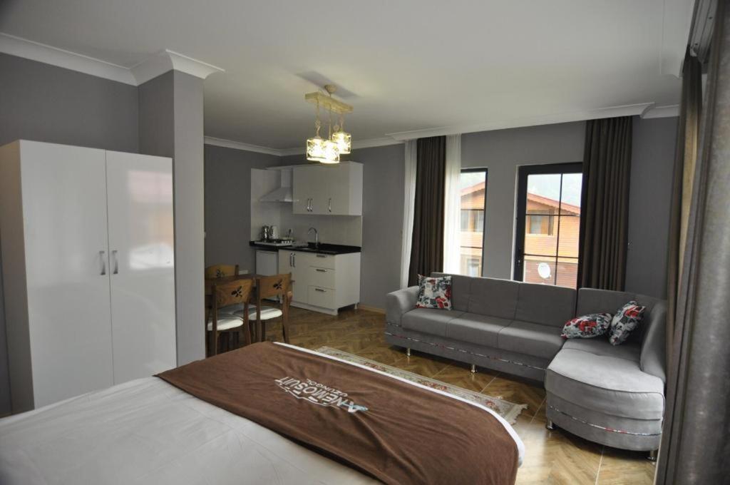 A bed or beds in a room at Anemo Suite