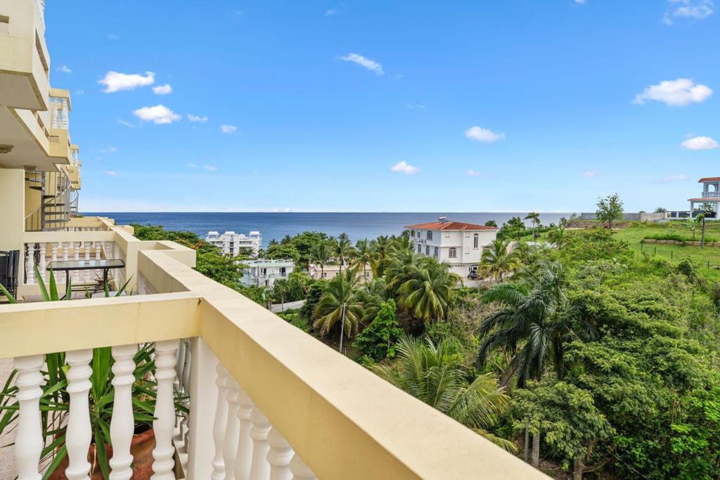 a balcony with a view of the ocean at Puntas Rincon Villa 301 with private rooftop terrace in Rincon