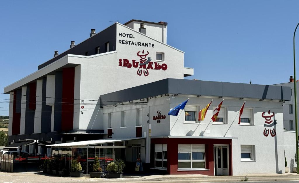 a hotel with a sign that reads hotel insurance at Hostal Restaurante Iruñako in Burgos