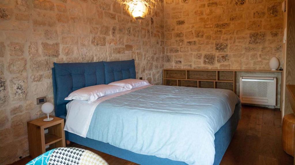 Postel nebo postele na pokoji v ubytování DONNAPAOLA MODERN FARM