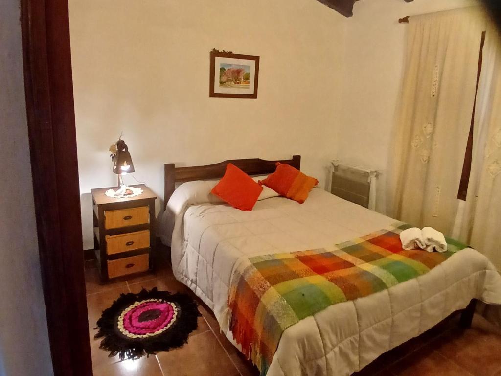 Postel nebo postele na pokoji v ubytování Cabañas Loma de El Pelao