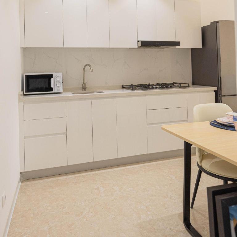Kuchyň nebo kuchyňský kout v ubytování ViVi Aparthotel