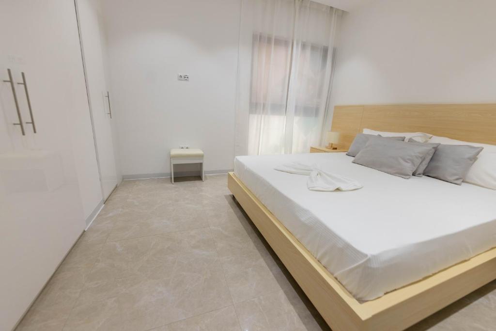 Postel nebo postele na pokoji v ubytování ViVi Aparthotel