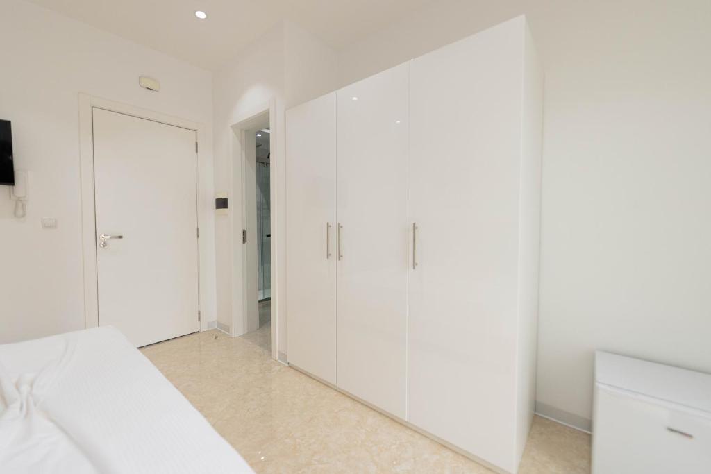 Postel nebo postele na pokoji v ubytování ViVi Aparthotel