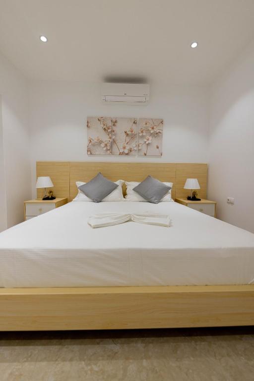 Postel nebo postele na pokoji v ubytování ViVi Aparthotel