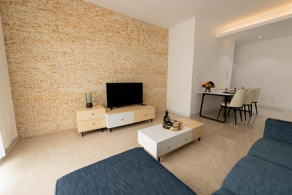 TV a/nebo společenská místnost v ubytování ViVi Aparthotel
