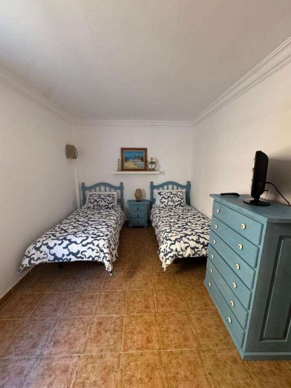 Postel nebo postele na pokoji v ubytování Vivienda vacacional Roque Puerto Naos