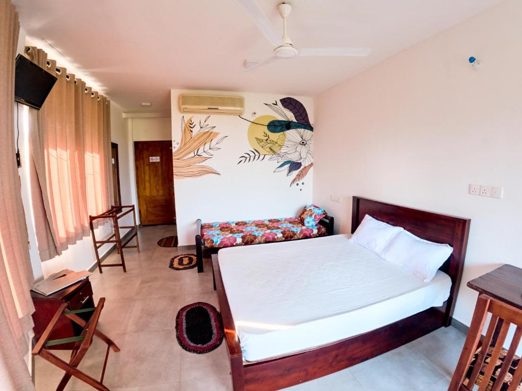 Postel nebo postele na pokoji v ubytování Baden Beach Hotel