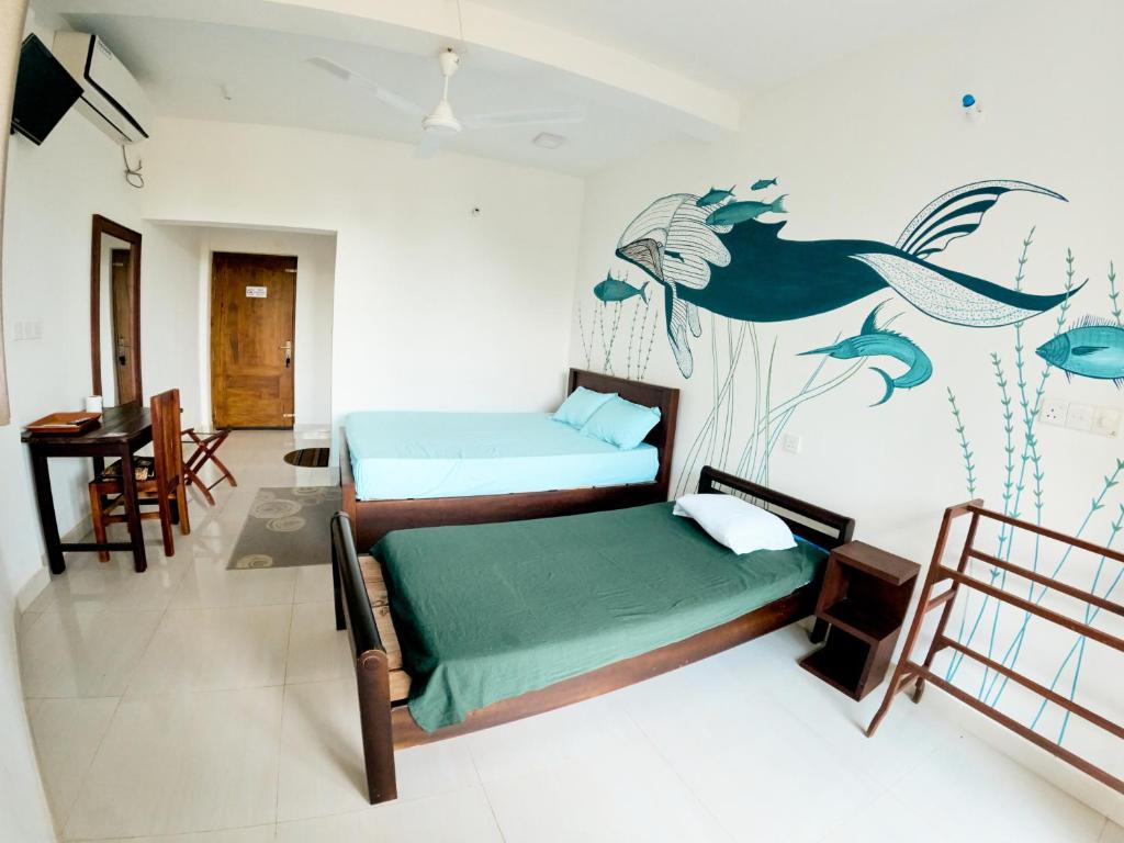 Postel nebo postele na pokoji v ubytování Baden Beach Hotel