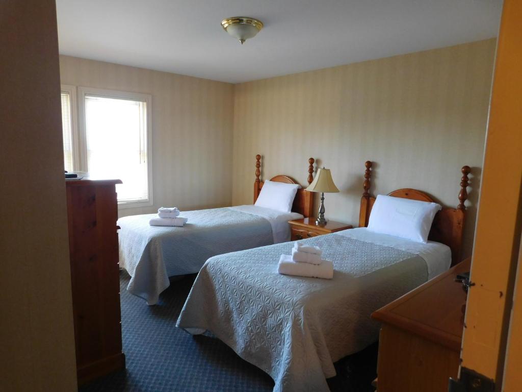 Katil atau katil-katil dalam bilik di Rainbow Bed & Breakfast
