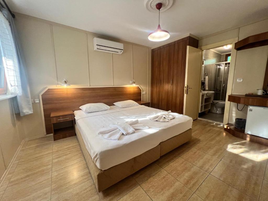 Postel nebo postele na pokoji v ubytování Grenadine Lodge