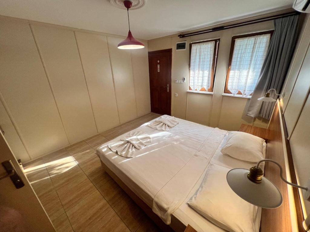 Postel nebo postele na pokoji v ubytování Grenadine Lodge