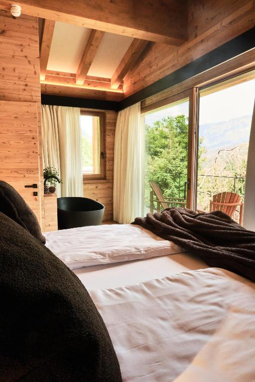 Postel nebo postele na pokoji v ubytování Boutique Hotel e Chalets Salvadori