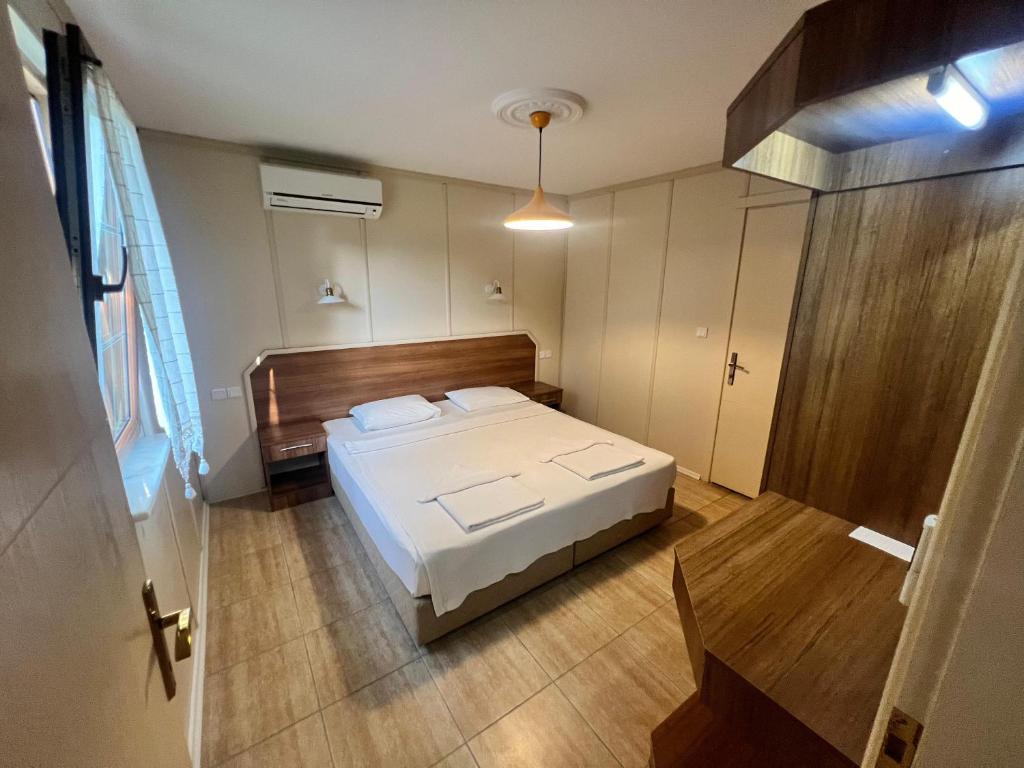 Postel nebo postele na pokoji v ubytování Grenadine Lodge