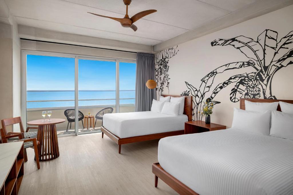 Postel nebo postele na pokoji v ubytování Hyatt Vivid Grand Island Cancun-All Inclusive Adults Only