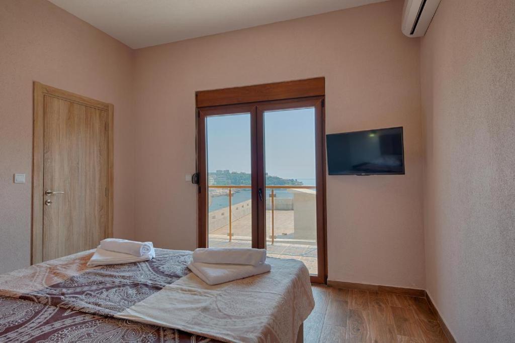 Vuode tai vuoteita majoituspaikassa Apart Hotel XXL Lux