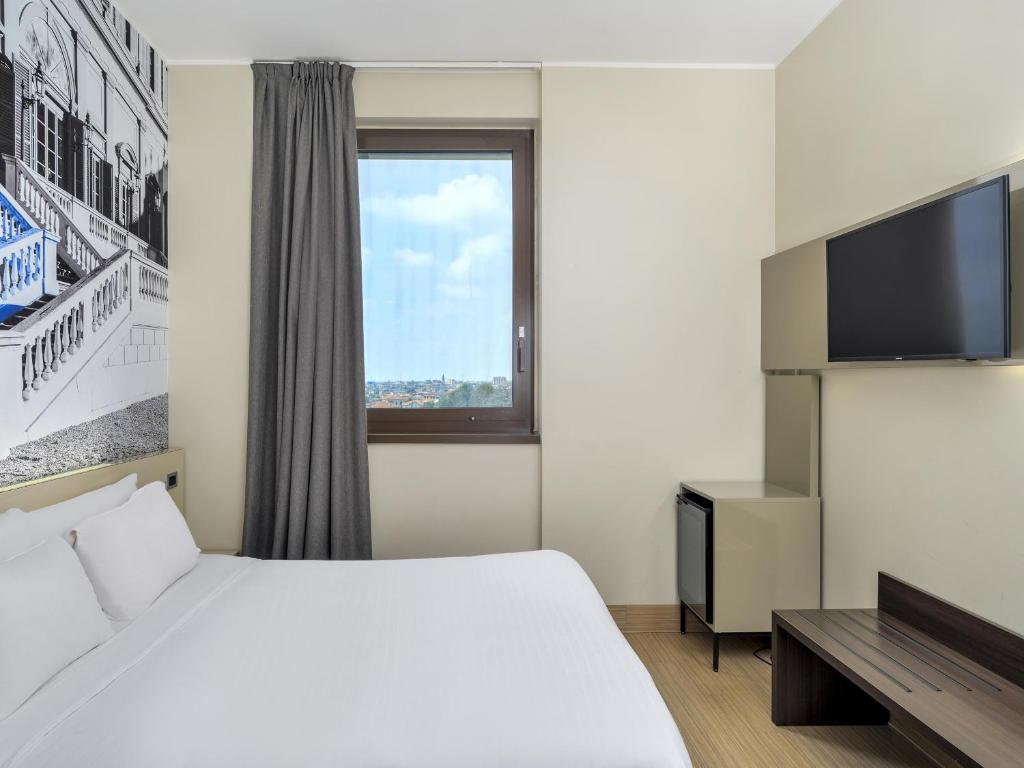 Postel nebo postele na pokoji v ubytování B&B Hotel Milano-Monza