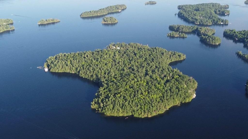 an island in the middle of a large body of water at Family Cottage Sheep Island in Delta
