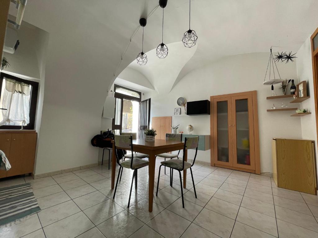 a kitchen with a table and chairs in a room at La casetta in Montenero di Bisaccia